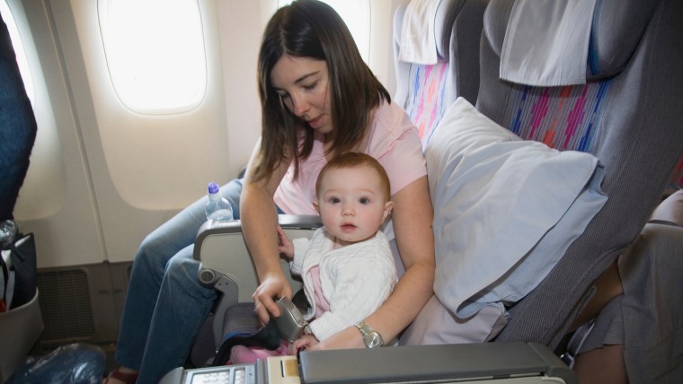 mother and baby in airplane