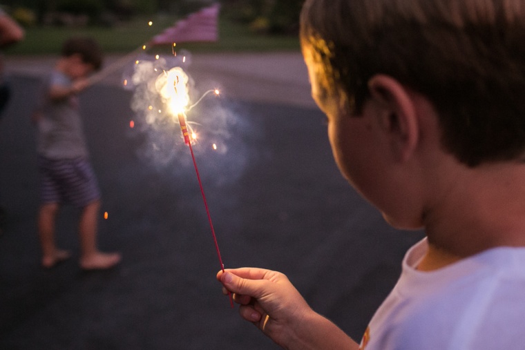 For additional lighting in nighttime photos, consider summer staples like sparklers or glow sticks.