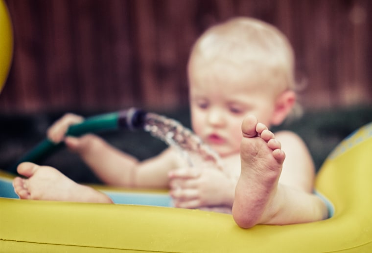 Angenend says it's easiest to snap images of kids when they're inthralled in an activity, such as playing with water.