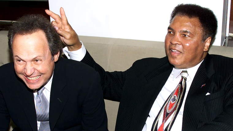 Billy Crystal &amp; Muhammad Ali at Audemars Piguet's Time To Give Celebrity Watch Auction For Charity, held at Christie's Auction House in New York City.