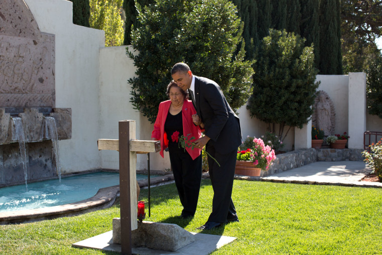 President Barack Obama and Helen Chavez place a rose at the gravesite of Cesar Chavez before the dedication ceremony for the Cesar E. Chavez National Monument in Keene, Calif., Oct. 8, 2012. (Official White House Photo by Pete Souza)