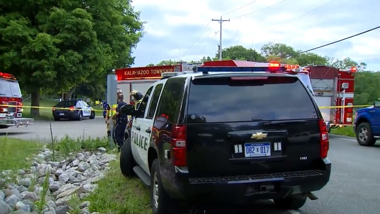 Authorities at the scene of a git-and-run crash Tuesday Cooper Township, Michigan, near Kalamazoo.