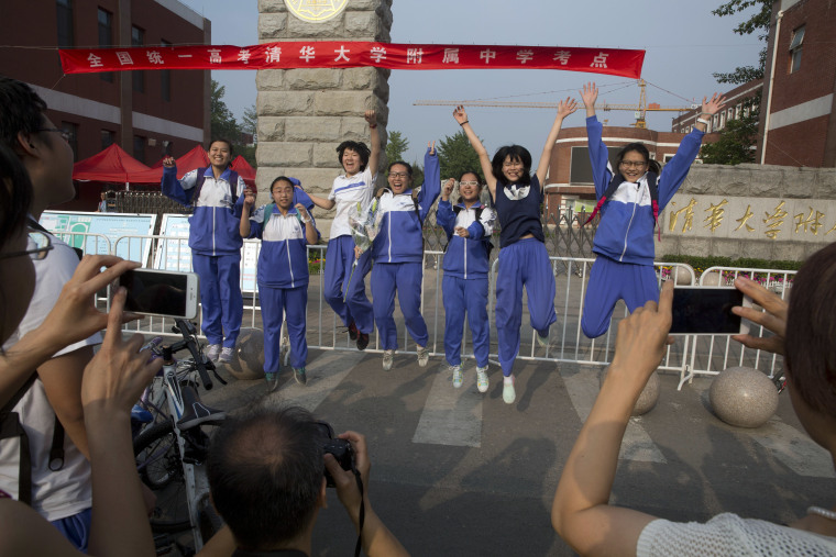 Image: Students jump after completing exam in Beijing