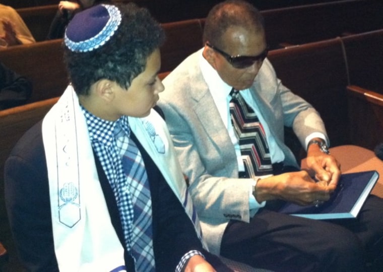 Jacob Wertheimer with his grandfather, Muhammad Ali at his bar mitzvah in 2012.