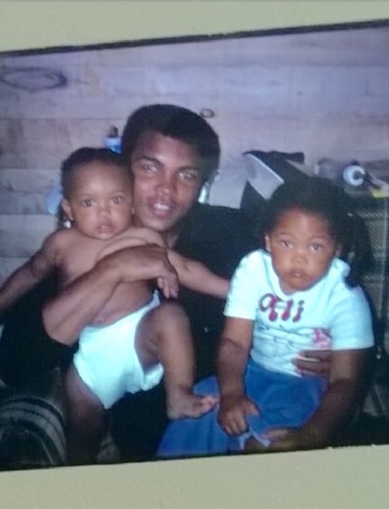 A childhood photo of Khaliah Ali, right, with her father Muhammad Ali, who is holding her younger sister, Hana Ali.