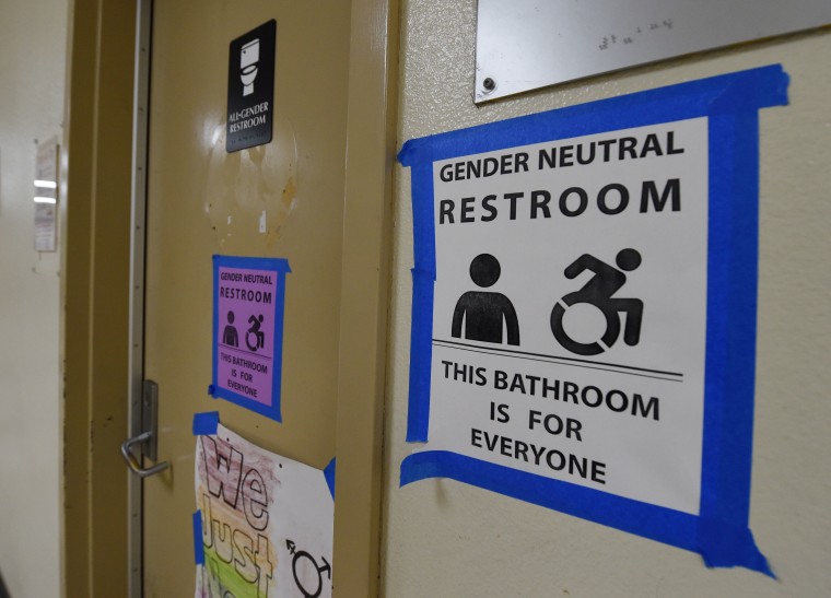 Signs are posted outside the Santee High School's gender neutral restrooms at their campus in Los Angeles, California on May 4, 2016.