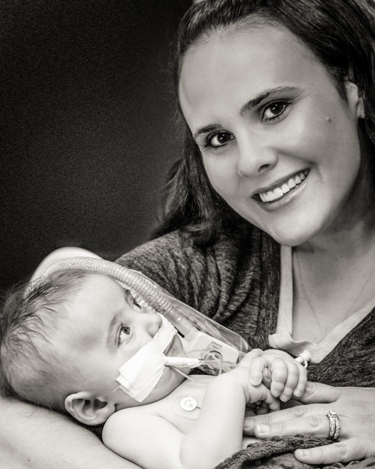 "I would have normally thought taking photos with my child that had just passed away in my arms would have been strange, but I am so glad we did this," said Ohmer, pictured with her son, Isaac.