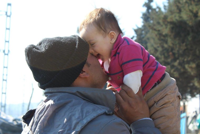 refugee dad with baby