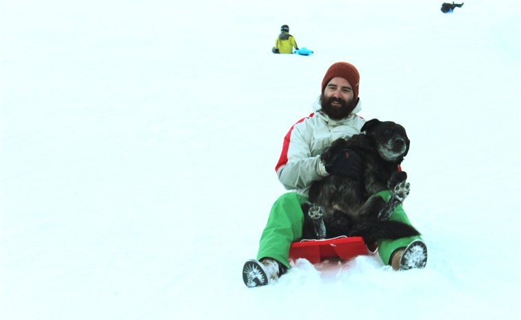 Gordon Delacroix sledding with Birdy