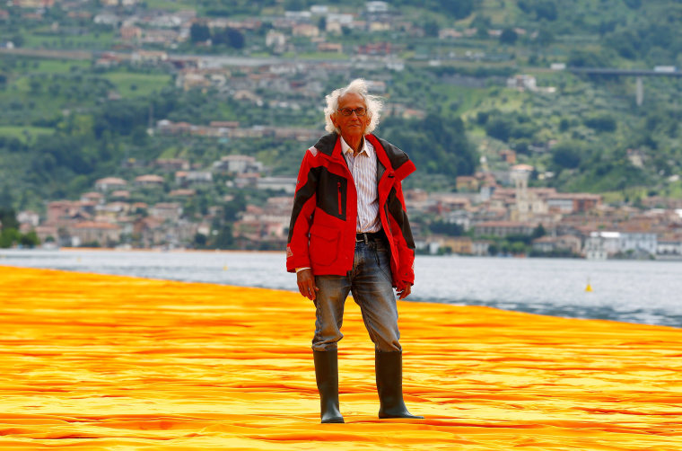 Bulgarian-born artist Christo Vladimirov Yavachev known as Christo stands on his installation 'The Floating Piers', on the Lake Iseo, northern Italy, June 16, 2016.REUTERS/Stefano Rellandini