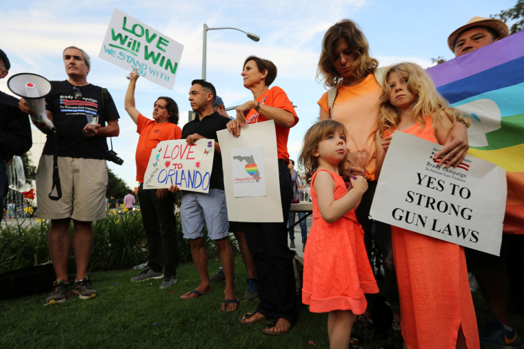 Image: People attend a vigil in West Hollywood