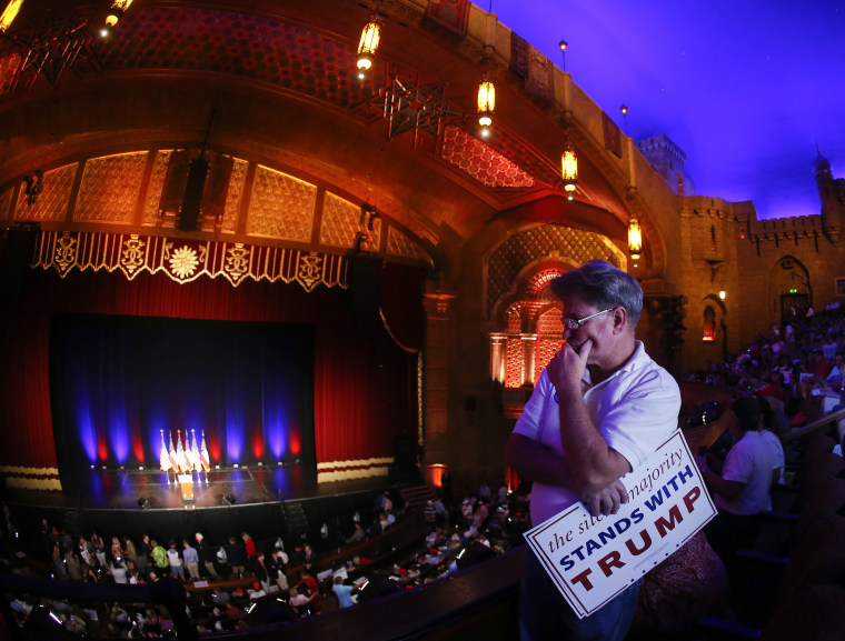 Image: Tim Youngblood waits for Republican presidential candidate Donald Trump to arrive