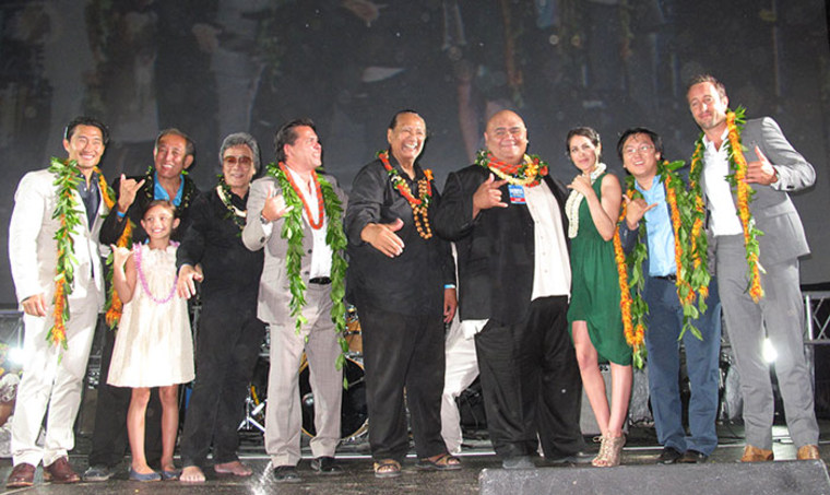 Jimmy Borges with the "Hawaii Five-0 cast" and its executive producer celebrating the season three premiere on Waikiki Beach.