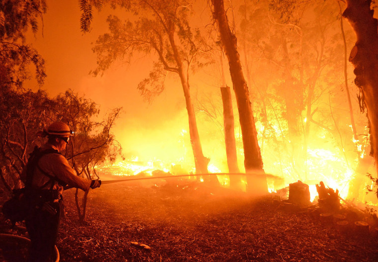 Image: Handout photo of a firefighter battling the Sherpa Fire in Santa Barbara, California