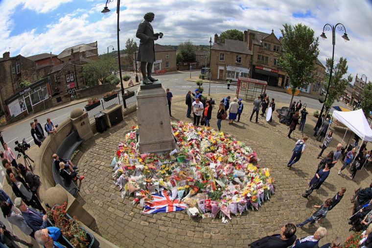 Image: Locals view the growing amount of flowers and tributes to Jo Cox MP