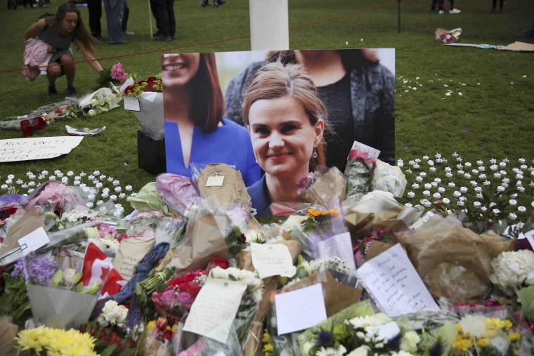 Image: Tributes in memory of murdered Labour Party MP Jo Cox, are left at Parliament Square in London