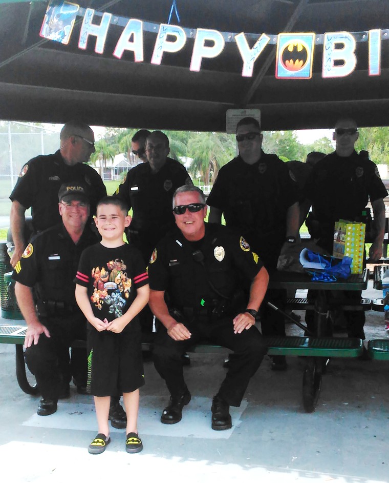 Police surprise boy with autism at birthday party after no one RSVPs.