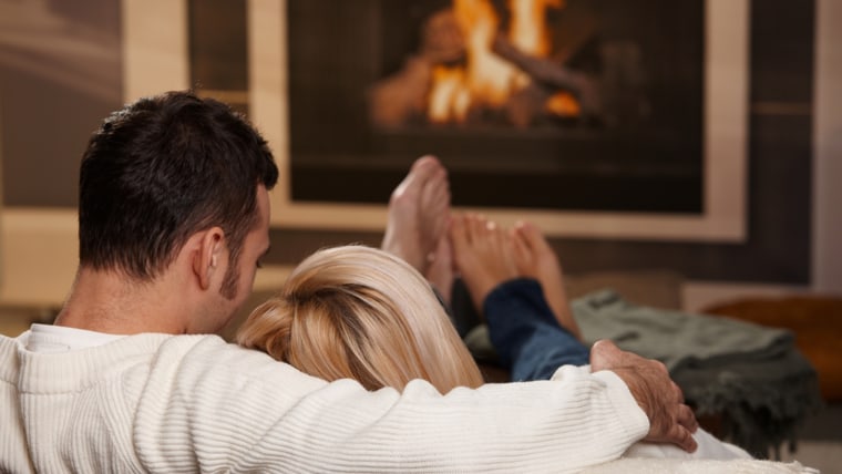 couple by fireplace