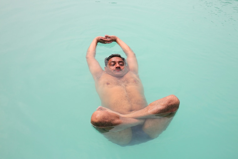 Image: People preactice water yoga in a pool in preparation for the International Day of Yoga in Bhopal