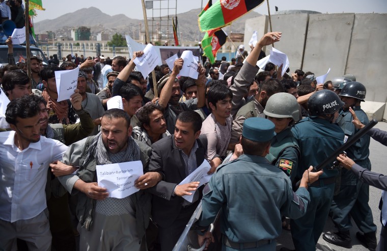 Image: Afghan protesters shout slogans during a demonstration against Taliban militants and the kidnapping of civilians