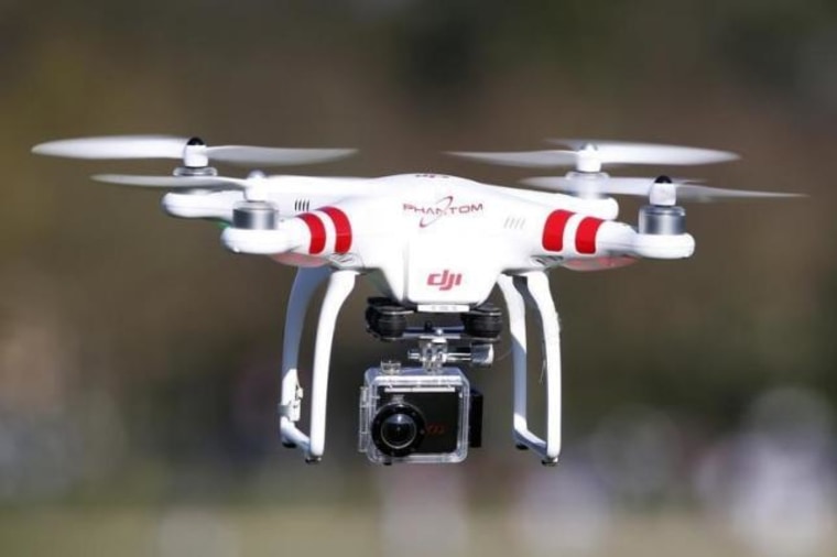 A Phantom drone by DJI company, equipped with a camera, flies during the 4th Intergalactic Meeting of Phantom's Pilots in an open secure area in the Bois de Boulogne, western Paris