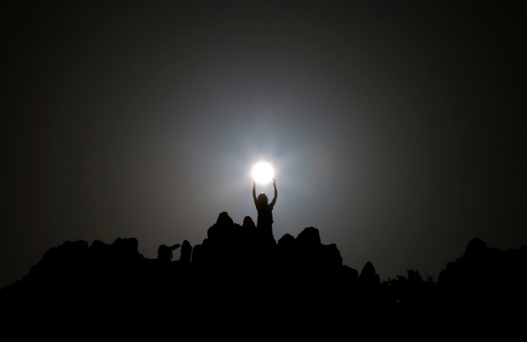 Image: People celebrate the summer solstice at the Kokino megalithic observatory near the city of Kumanovo