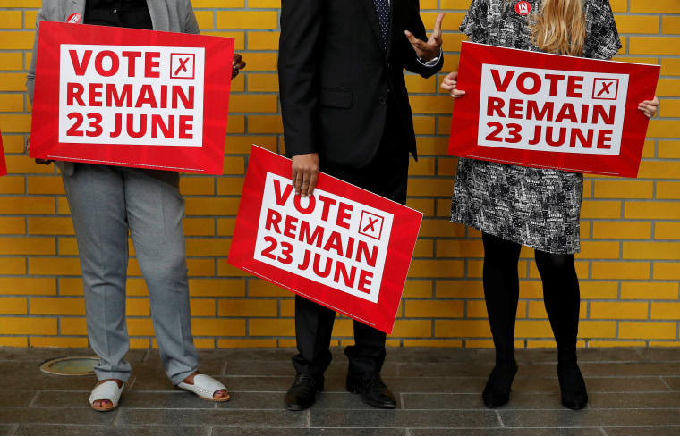 Image: Local council leaders hold placards during a Vote Remain event at Manchester Metropolitan University's student Union in Manchester, northern England.
