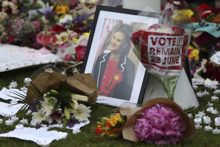Image: Tributes in memory of murdered Labour Party MP Jo Cox, are left at Parliament Square in London