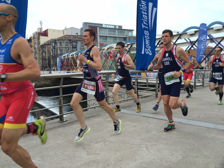 Transgender athlete Chris Mosier competes in the International Triathlon Union World Championship in Spain.