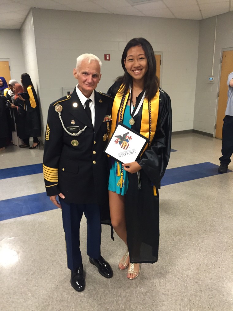 Iris Yu with her mentor, 1st Sgt. Richard Gogarty, at Yu's high school graduation.