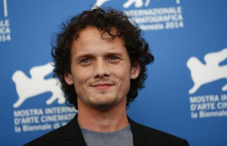 Cast member Yelchin poses during the photo call for the movie "Burying the ex" at the 71st Venice Film Festival