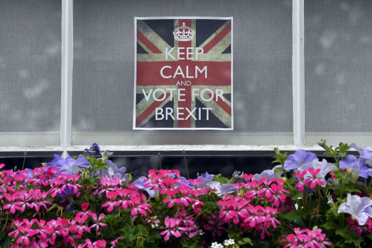 Image: Vote leave posters are seen in a window in Chelsea, London