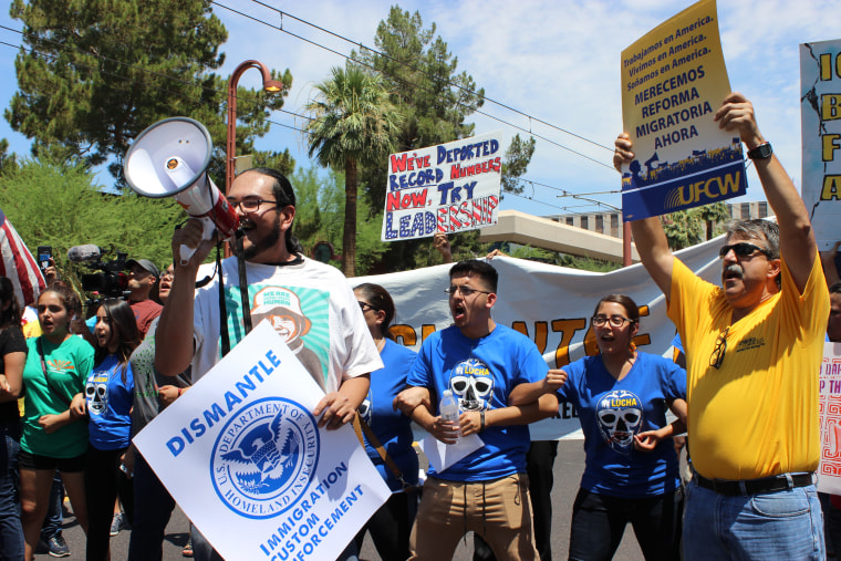 Dozens protested Thursday outside the U.S. Immigration and Customs Enforcement office in Phoenix hours after the U.S. Supreme Court issued a 4-4 ruling over President Obama's immigration plan.