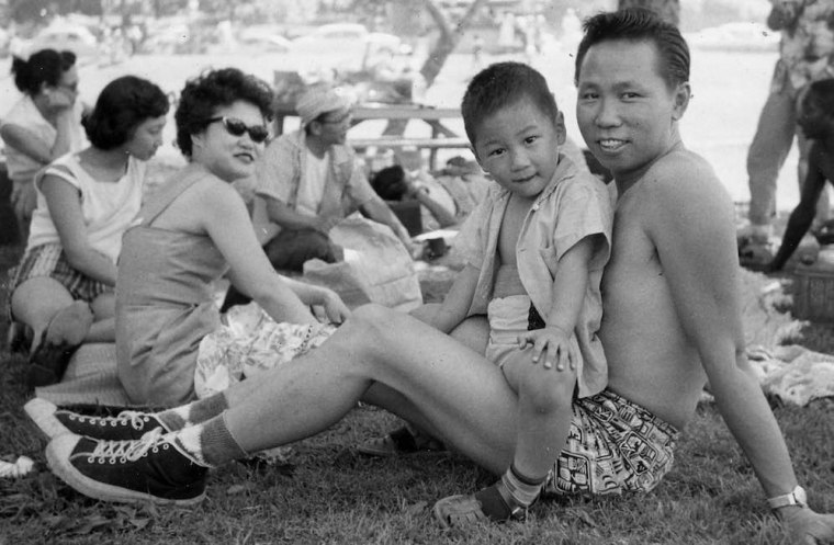 Ray Kwong (center) with his father and mother.