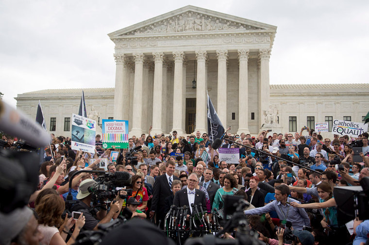 James "Jim" Obergefell, named plaintiff in the Obergefell v. Hodges case, bottom center, speaks to the media after the same-sex marriage ruling outside the U.S. Supreme Court in Washington, D.C., U.S., on Friday, June 26, 2015.