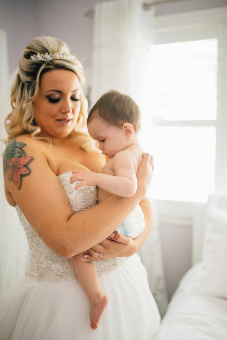 Bride Christina Torino-Benton is pictured before the wedding ceremony with her 9-month-old daughter, Gemma.