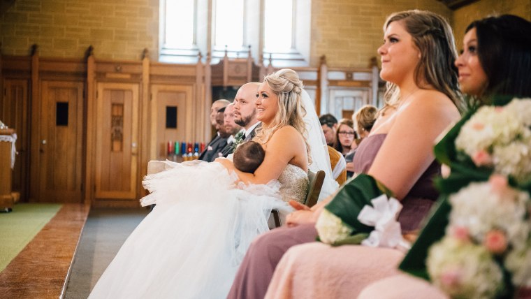 Christina Torino-Benton nurses her 9-month-old daughter during her wedding ceremony in Montreal.