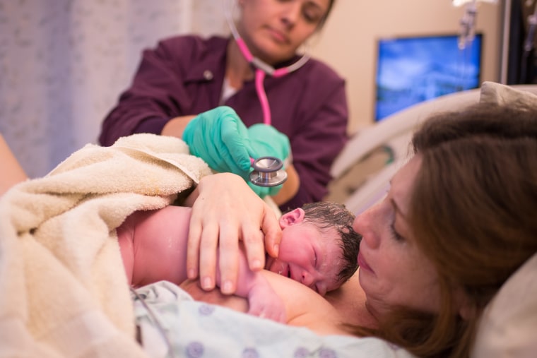 Once her daughter was born, Robinson handed the camera off to her mother, who continued to snap photos while she bonded with Anora, breastfeeding and having skin-to-skin contact with the newborn.