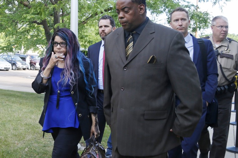 Image: Tyka Nelson, left, the sister of the Prince, arrives at the Carver County courthouse in Chaska, Minn.on June 27, 2016 with her husband, Maurice Phillips