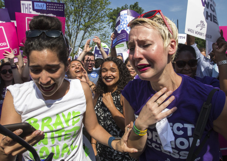 Image: Abortion rights activists Morgan Hopkins of Boston, left, and Alison Turkos of New York City, rejoice