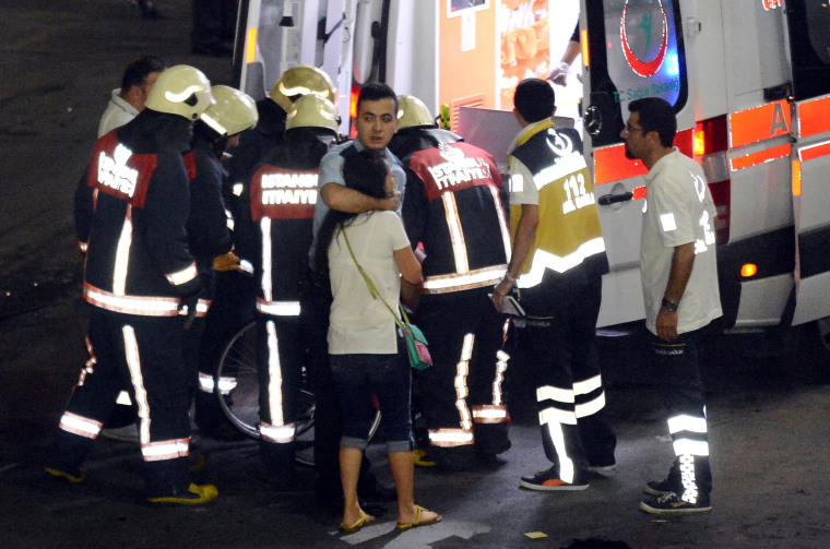 Image: Paramedics help injured outside Turkey's largest airport, Istanbul Ataturk following a blast