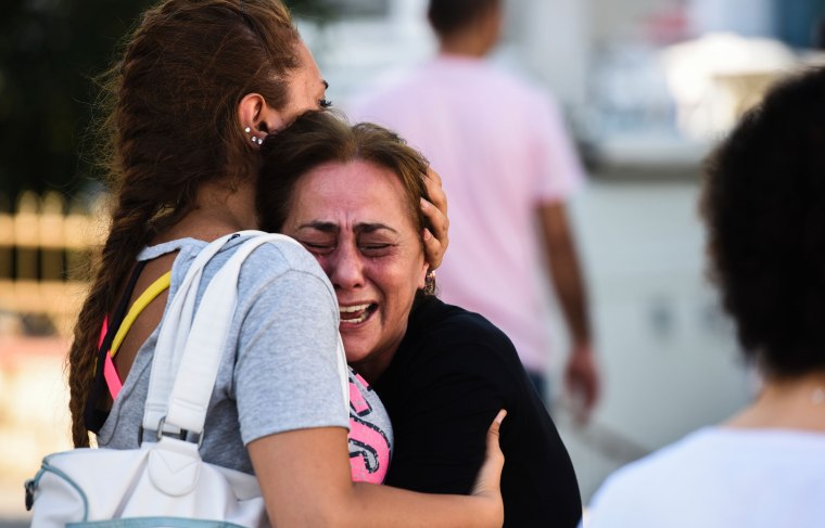 Image: A mother of a victim reacts after Ataturk airport attack