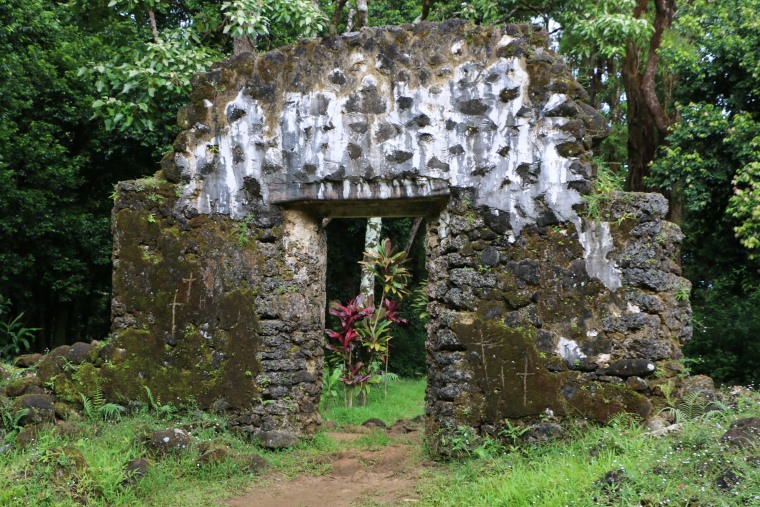 This undated photo, provided by the Hawaii Department of Land and Natural Resources, shows the crumbling remains of the 180-year-old summer palace of former King Kamehameha III where vandals etched crosses in the forest of a Honolulu, Hawaii, neighborhood. The Department said Thursday, June 23, 2016, that unless the vandals are caught desecrating the sacred cultural site, there's little law enforcement officers can do.