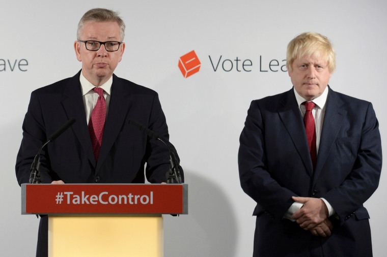 Image: Britain's Justice Secretary Michael Gove speaks as Vote Leave campaign leader Boris Johnson listens at the group