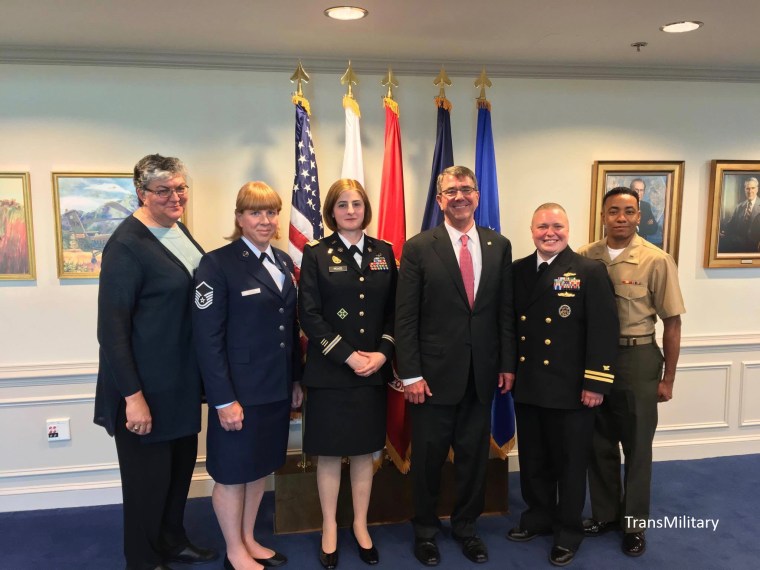 Transgender service members from SPARTA pose with SPARTA's Sue Fulton, far left, and Secretary of Defense Ash Carter, third from right.