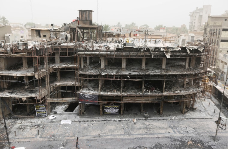 Image: The site of a suicide car bomb attack in Baghdad