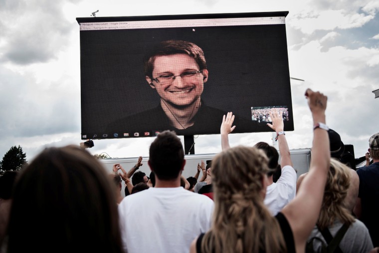 American whistleblower Edward Snowden is seen on a screen as he delivers a speech during the Roskilde Festival in Roskilde, Denmark, June 28 2016. Scanpix Denmark/Mathias Loevgreen Bojesen /via REUTERS   ATTENTION EDITORS - THIS IMAGE WAS PROVIDED BY A THIRD PARTY. FOR EDITORIAL USE ONLY.DENMARK OUT.NO COMMERCIAL OR EDITORIAL SALES IN DENMARK