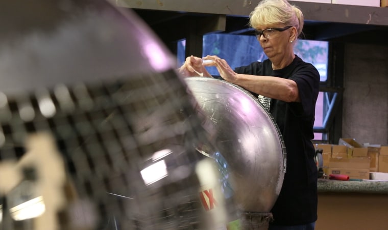 Image: Yolanda Baker assembles a disco ball