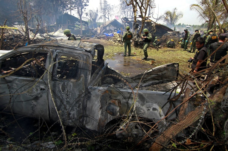 Image: Thai EOD personnel inspect the site of a bomb attack where police officers were injured, at Nong Chik district in the troubled southern province of Pattani