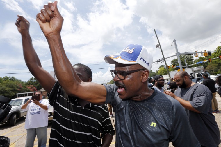 Image: People chant \"Black lives matter\" outside the Triple S convenience store in Baton Rouge